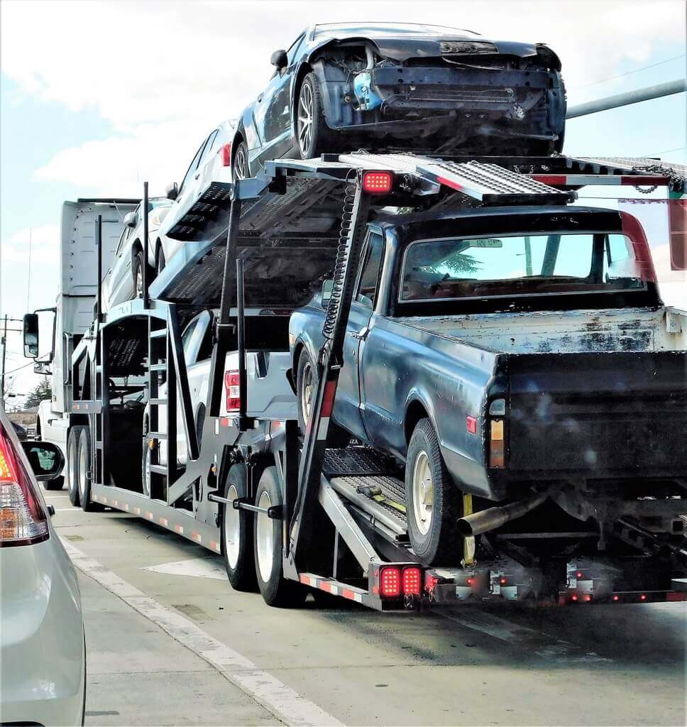 car hauler trailer with wrecked cars